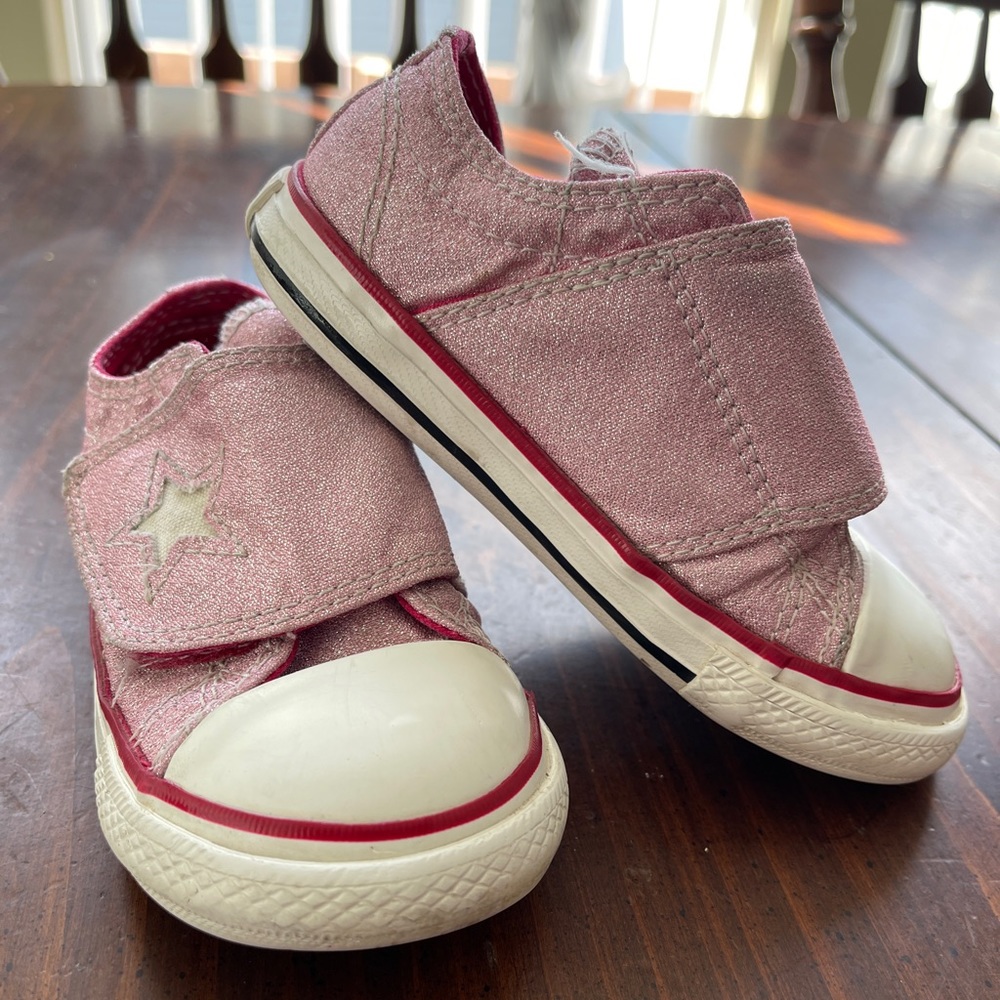 Pink sparkly converse.
